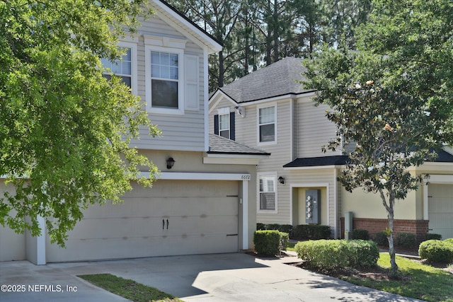 8672 Ribbon Falls Ln, Jacksonville, FL 32244 - view of front of home with driveway and roof with shingles