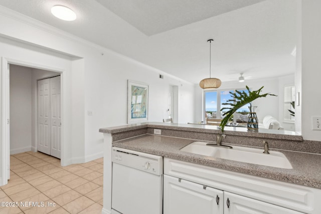 4776 Amelia Island Pkwy Unit 74, Fernandina Beach, FL 32034 - kitchen with white dishwasher, a sink, white cabinetry, a ceiling fan, and light tile patterned floors