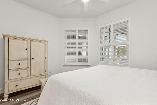 4776 Amelia Island Pkwy Unit 74, Fernandina Beach, FL 32034 - bedroom with dark wood-style flooring and ceiling fan