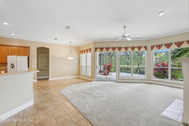 2260 Harbor Lake Dr, Fleming Island, FL 32003 - unfurnished living room featuring ceiling fan, arched walkways, baseboards, recessed lighting, and crown molding