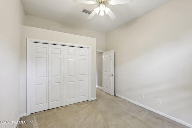 2260 Harbor Lake Dr, Fleming Island, FL 32003 - unfurnished bedroom featuring carpet, baseboards, a closet, and a ceiling fan