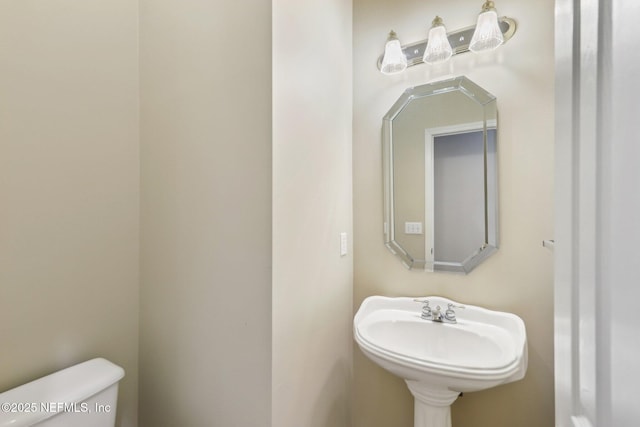 2260 Harbor Lake Dr, Fleming Island, FL 32003 - half bathroom featuring toilet and a sink