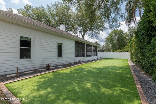 view of yard featuring a sunroom