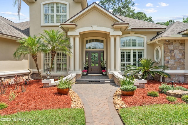 389 Summerset Dr, Saint Johns, FL 32259 - view of exterior entry featuring french doors, a shingled roof, and stucco siding