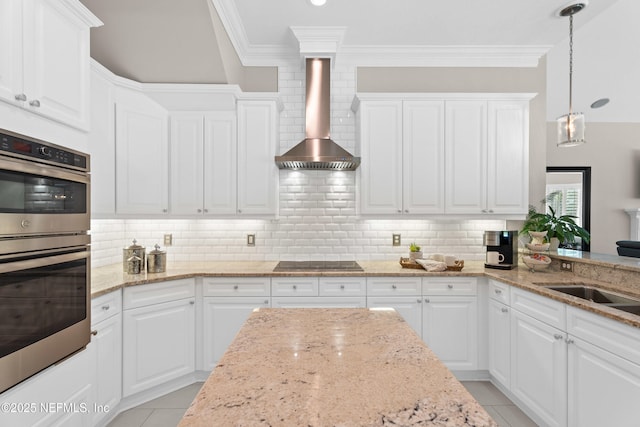 389 Summerset Dr, Saint Johns, FL 32259 - kitchen featuring double oven, crown molding, black electric cooktop, wall chimney exhaust hood, and white cabinetry