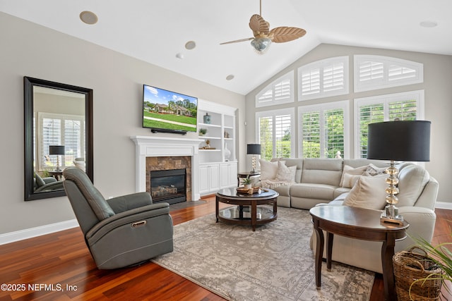 389 Summerset Dr, Saint Johns, FL 32259 - living area with healthy amount of natural light, wood finished floors, a ceiling fan, a fireplace, and high vaulted ceiling