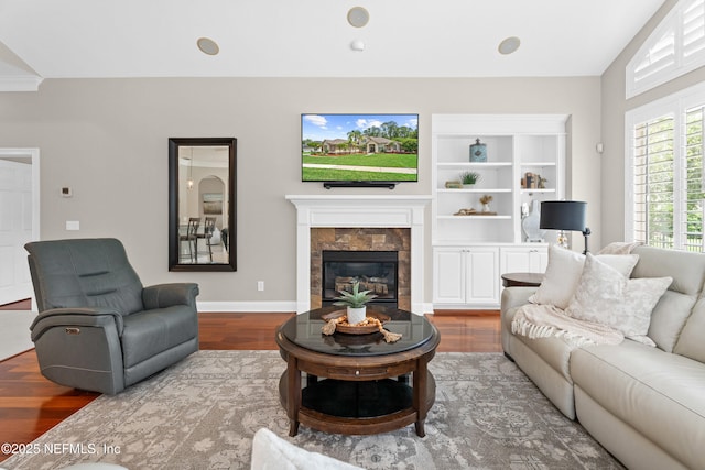 389 Summerset Dr, Saint Johns, FL 32259 - living area with wood finished floors, a fireplace, and baseboards