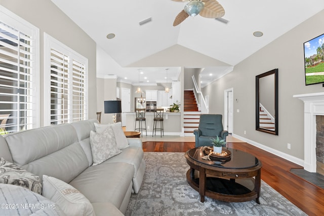 389 Summerset Dr, Saint Johns, FL 32259 - living room featuring stairway, wood finished floors, ceiling fan, healthy amount of natural light, and lofted ceiling