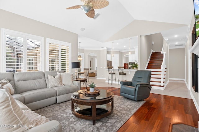389 Summerset Dr, Saint Johns, FL 32259 - living area with ceiling fan, stairs, light wood finished floors, plenty of natural light, and lofted ceiling