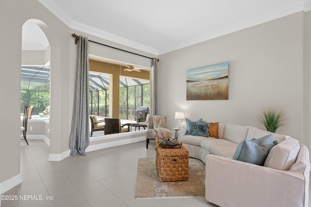 389 Summerset Dr, Saint Johns, FL 32259 - living room with ornamental molding, tile patterned floors, baseboards, and arched walkways