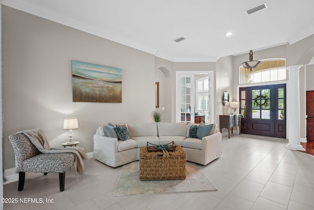 389 Summerset Dr, Saint Johns, FL 32259 - living area featuring decorative columns, arched walkways, ornamental molding, baseboards, and light tile patterned floors