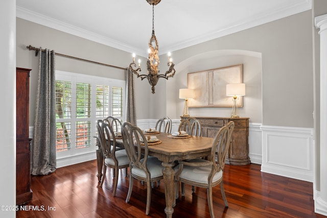 389 Summerset Dr, Saint Johns, FL 32259 - dining area with crown molding, a chandelier, wainscoting, and dark wood-style floors
