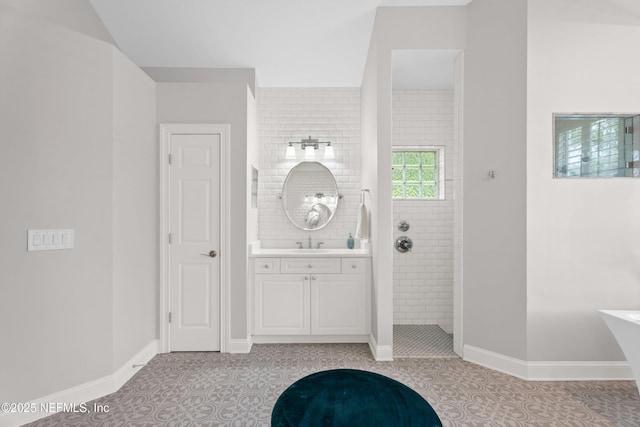 389 Summerset Dr, Saint Johns, FL 32259 - full bathroom featuring a walk in shower, vanity, baseboards, and a freestanding bath