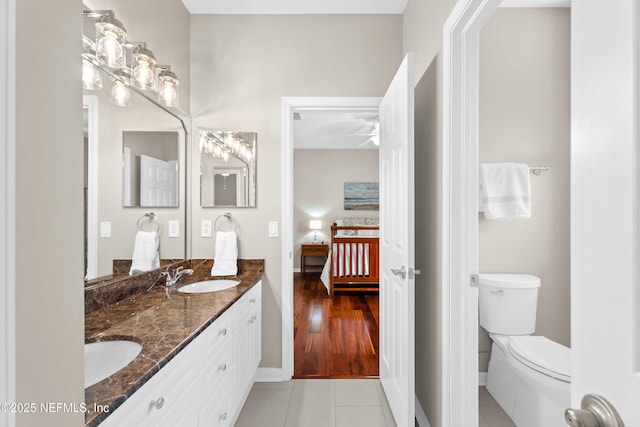 389 Summerset Dr, Saint Johns, FL 32259 - bathroom featuring ensuite bath, toilet, double vanity, tile patterned flooring, and baseboards