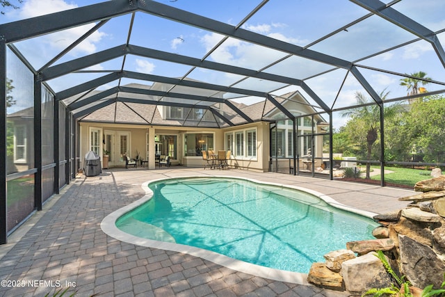 389 Summerset Dr, Saint Johns, FL 32259 - swimming pool with a patio, french doors, and glass enclosure