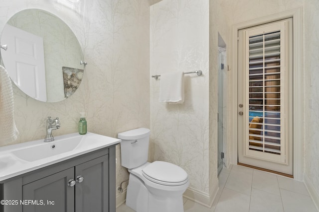 389 Summerset Dr, Saint Johns, FL 32259 - bathroom featuring toilet, wallpapered walls, vanity, a shower stall, and baseboards