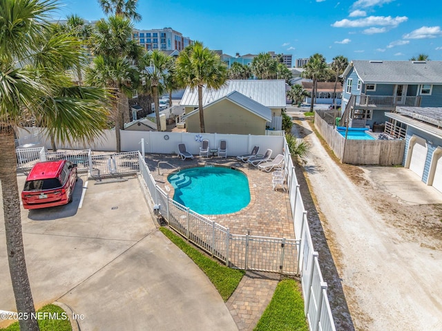 932 1st St N Unit 902, Jacksonville Beach, FL 32250 - community pool with a fenced backyard, a patio, a gate, and a residential view