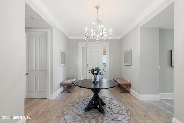 932 1st St N Unit 902, Jacksonville Beach, FL 32250 - foyer entrance featuring light wood-style flooring, baseboards, a chandelier, and ornamental molding
