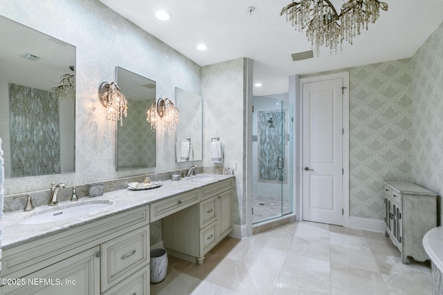 932 1st St N Unit 902, Jacksonville Beach, FL 32250 - bathroom with a chandelier, wallpapered walls, baseboards, a stall shower, and double vanity