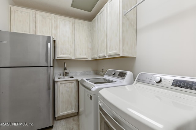 932 1st St N Unit 902, Jacksonville Beach, FL 32250 - washroom featuring washer and clothes dryer and light wood-type flooring