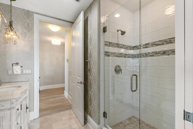 932 1st St N Unit 902, Jacksonville Beach, FL 32250 - full bath with a stall shower, vanity, and baseboards