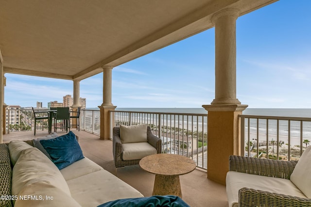 932 1st St N Unit 902, Jacksonville Beach, FL 32250 - balcony featuring view of water and beach and an outdoor living space