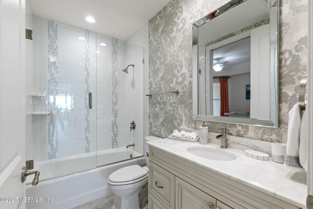 932 1st St N Unit 902, Jacksonville Beach, FL 32250 - full bath featuring wallpapered walls, vanity, combined bath / shower with glass door, toilet, and recessed lighting