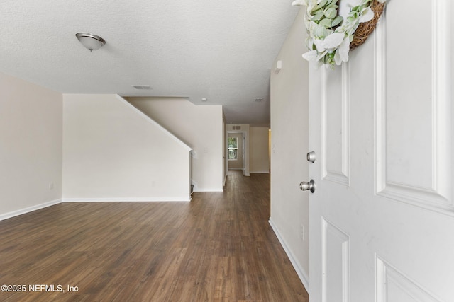 1343 Pangola Dr, Jacksonville, FL 32205 - foyer featuring stairs, wood finished floors, and a textured ceiling