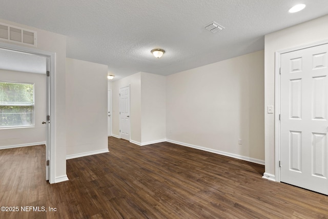 1343 Pangola Dr, Jacksonville, FL 32205 - spare room featuring wood finished floors and a textured ceiling
