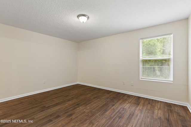1343 Pangola Dr, Jacksonville, FL 32205 - empty room with dark wood finished floors and a textured ceiling