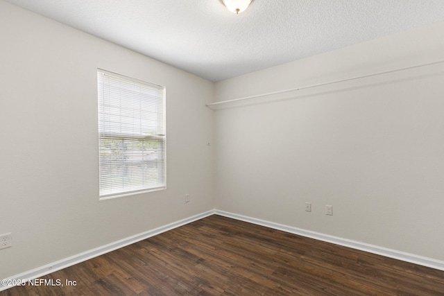 1343 Pangola Dr, Jacksonville, FL 32205 - unfurnished room featuring dark wood-style floors and baseboards