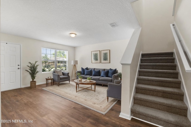 1343 Pangola Dr, Jacksonville, FL 32205 - living room featuring stairway, wood finished floors, and a textured ceiling