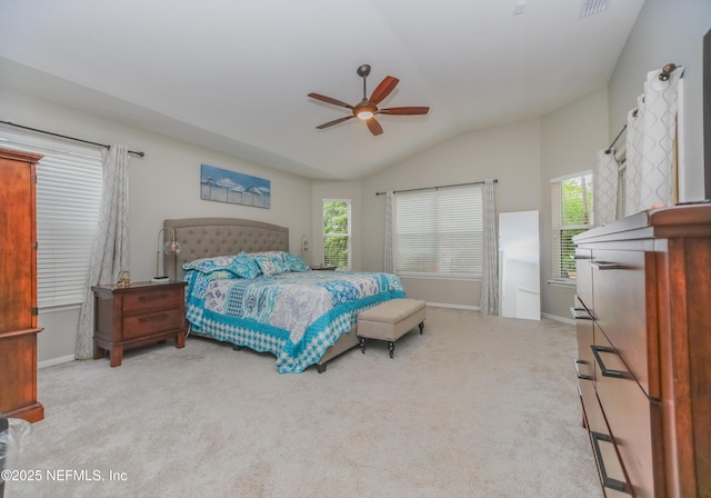 bedroom featuring vaulted ceiling, multiple windows, carpet floors, and baseboards