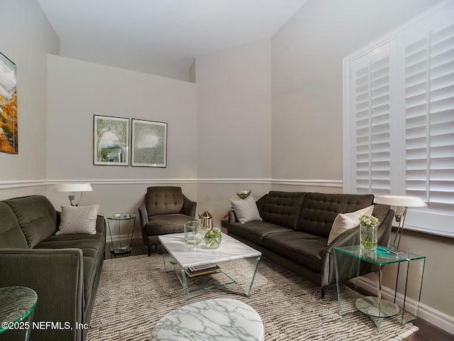 living room with wood finished floors and baseboards