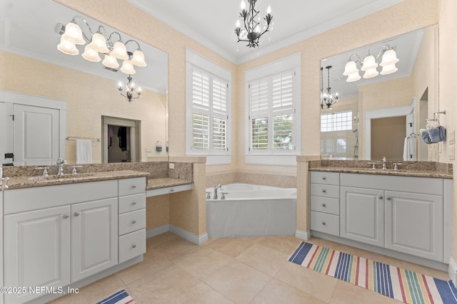 full bath with a chandelier, ornamental molding, a bath, two vanities, and a walk in shower