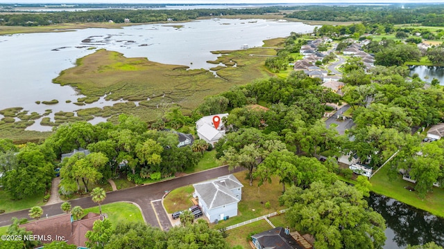 view of property location with a nearby body of water and nearby suburban area