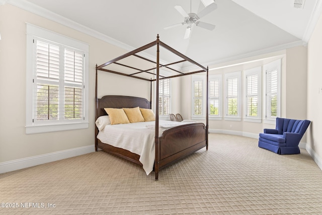 bedroom with multiple windows, baseboards, carpet, lofted ceiling, and ornamental molding