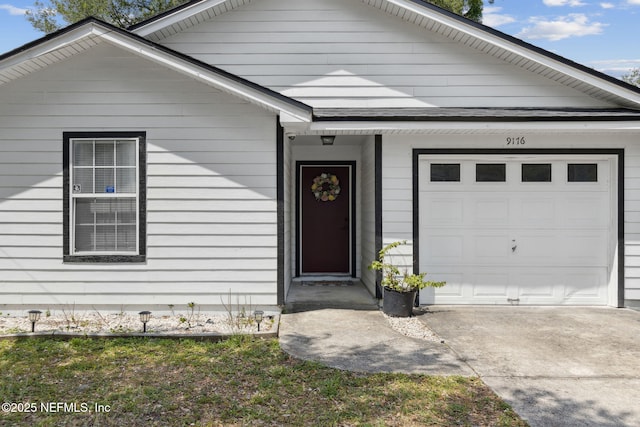 ranch-style house with an attached garage and driveway