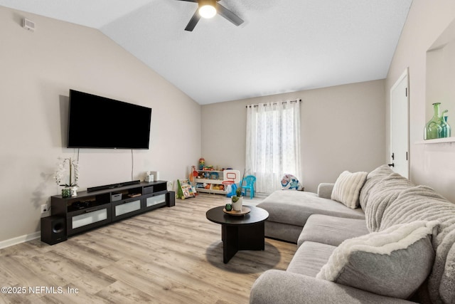 living area with vaulted ceiling, a ceiling fan, wood finished floors, and baseboards