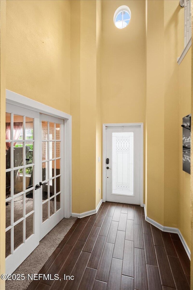 221 Thornloe Dr, Saint Johns, FL 32259 - foyer featuring a towering ceiling, baseboards, wood finish floors, and french doors