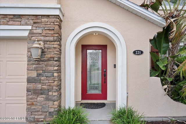 221 Thornloe Dr, Saint Johns, FL 32259 - doorway to property featuring stucco siding and stone siding