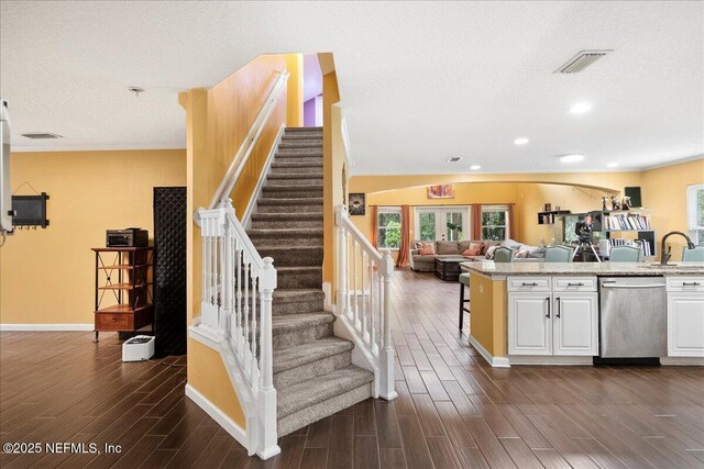 221 Thornloe Dr, Saint Johns, FL 32259 - stairway with wood finished floors, a textured ceiling, baseboards, and recessed lighting