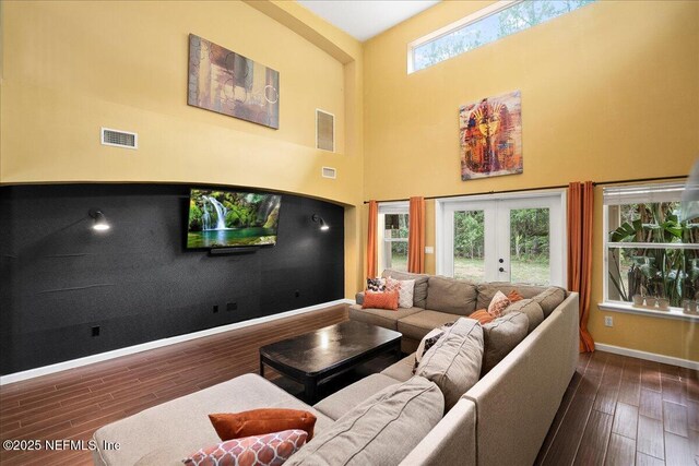 221 Thornloe Dr, Saint Johns, FL 32259 - living room with wood finished floors, a towering ceiling, baseboards, and french doors