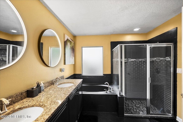 221 Thornloe Dr, Saint Johns, FL 32259 - bathroom with a textured ceiling, a shower stall, a bath, double vanity, and tile patterned floors
