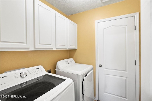 221 Thornloe Dr, Saint Johns, FL 32259 - washroom featuring separate washer and dryer, cabinet space, and a textured ceiling