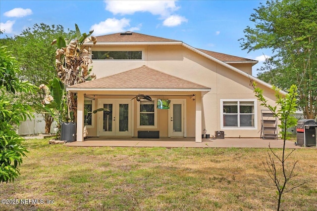 221 Thornloe Dr, Saint Johns, FL 32259 - rear view of house with a yard, french doors, a patio area, and stucco siding