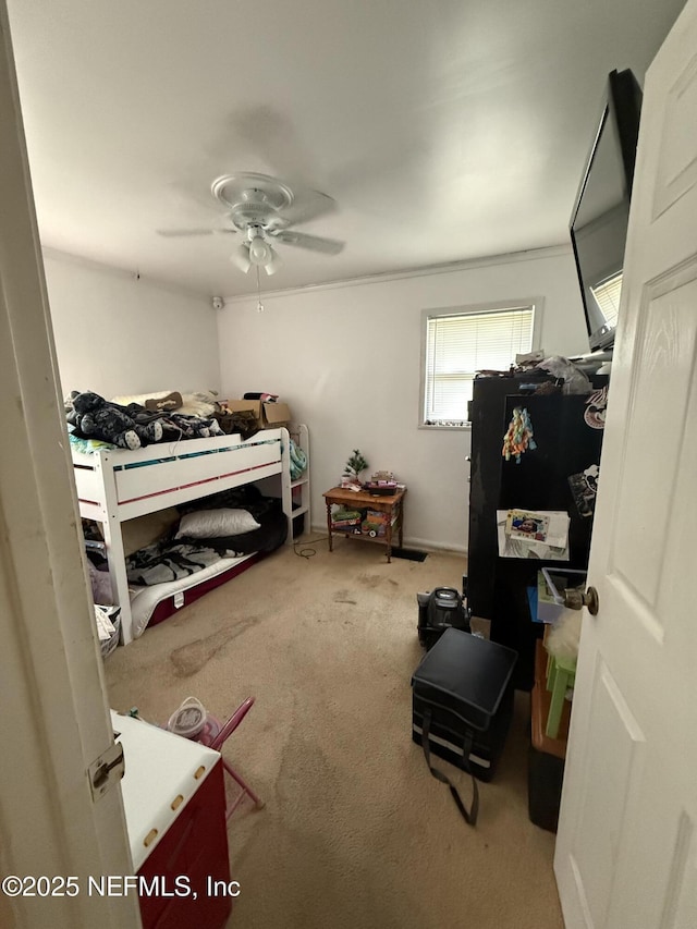 bedroom with carpet floors and a ceiling fan