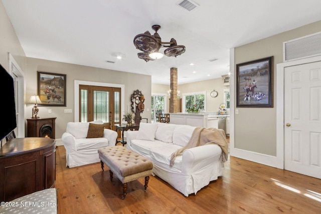 96448 Marsh Hen Rd, Fernandina Beach, FL 32034 - living room with a chandelier, light wood-type flooring, baseboards, and recessed lighting