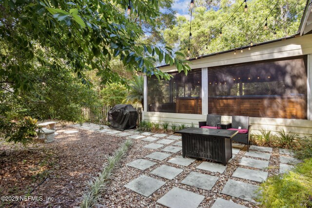 96448 Marsh Hen Rd, Fernandina Beach, FL 32034 - view of patio / terrace featuring a sunroom, a grill, and fence