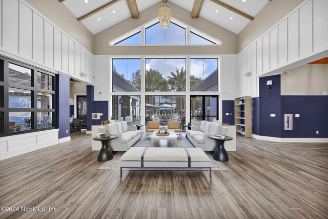 334 Continuum Loop, Yulee, FL 32097 - living area featuring high vaulted ceiling, wood finished floors, and beam ceiling